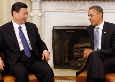 U.S. President Barack Obama (R) and then-Chinese-Vice-President Xi Jinping pose for photographs before meeting in the Oval Office at the White House February 14, 2012 in Washington, DC. (Chip Somodevilla/Getty Images)
