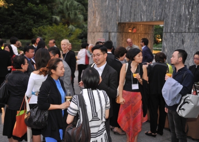 Summit speakers and participants mingle at the cocktail reception on the roof of the Asia Society Hong Kong Center. (Elvis Ho)