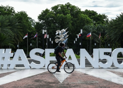 A man rides his bicycle in front of the ASEAN logo near the venue for the Association of Southeast Asia Nations (ASEAN) Regional Forum (ARF) meeting in Manila on August 4, 2017. (Mohd Rasfan/AFP/Getty Images)