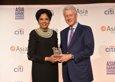 Indra Nooyi and Bill Clinton