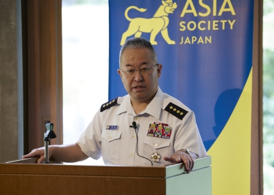 General YOSHIDA Yoshihide on podium talking to the audience