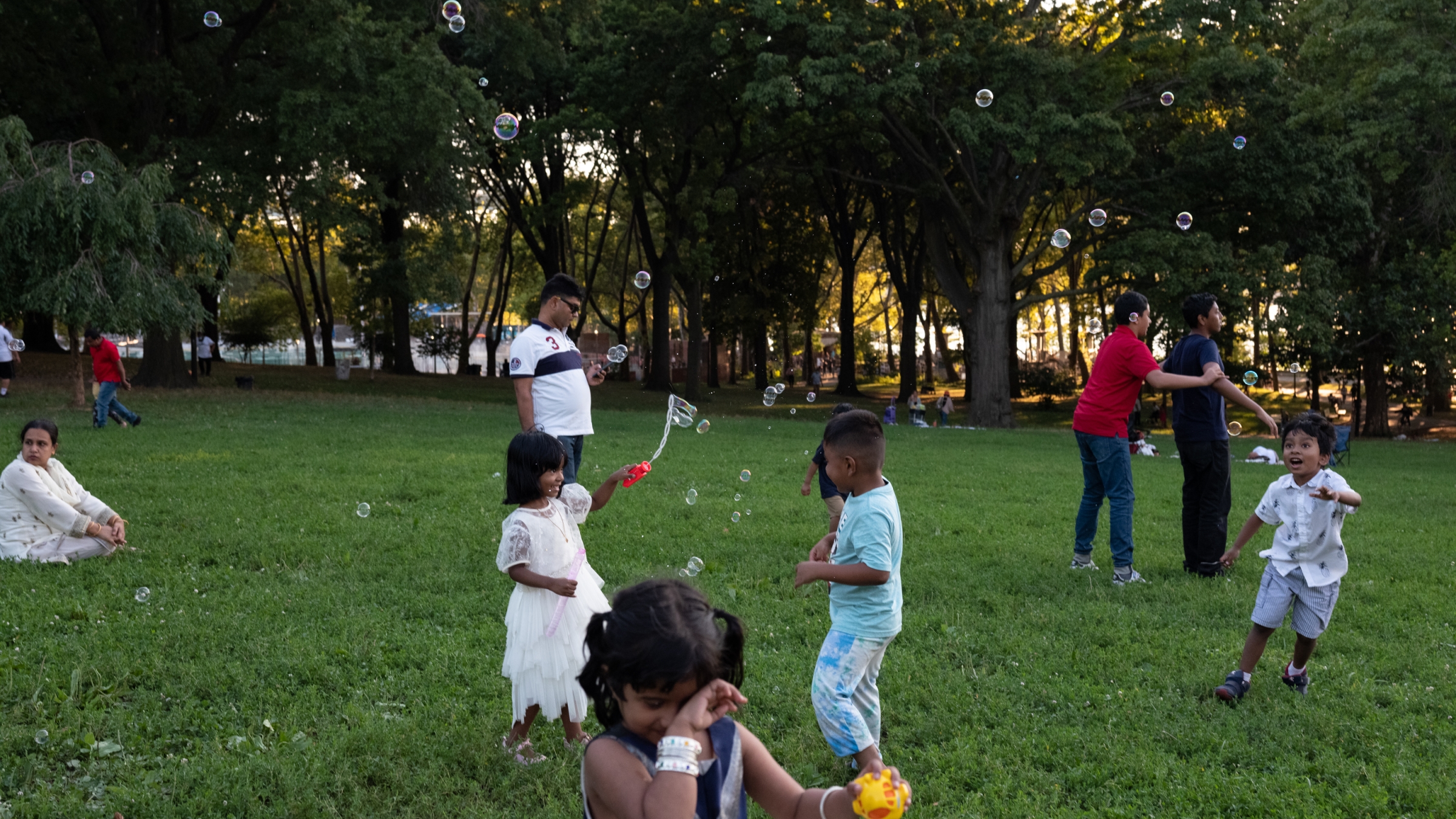 Children play at a picnic organized by the Bangladeshi American community in Astoria Park, Queens, on August 14, 2022.