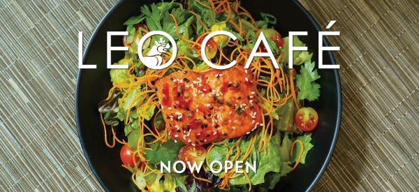 Photo of a salad with salmon and text reading "Leo Cafe Now Open"